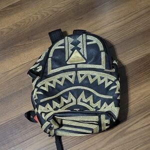 Sprayground Black and Gold Backpack